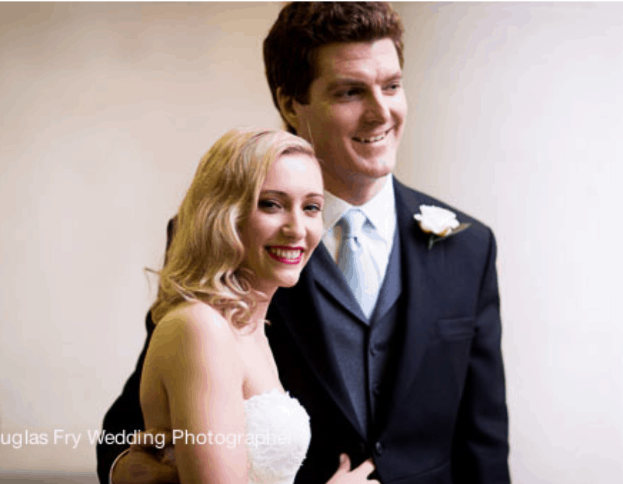 Bride and groom photographed after wedding service in front of St Etheldredas Church in London