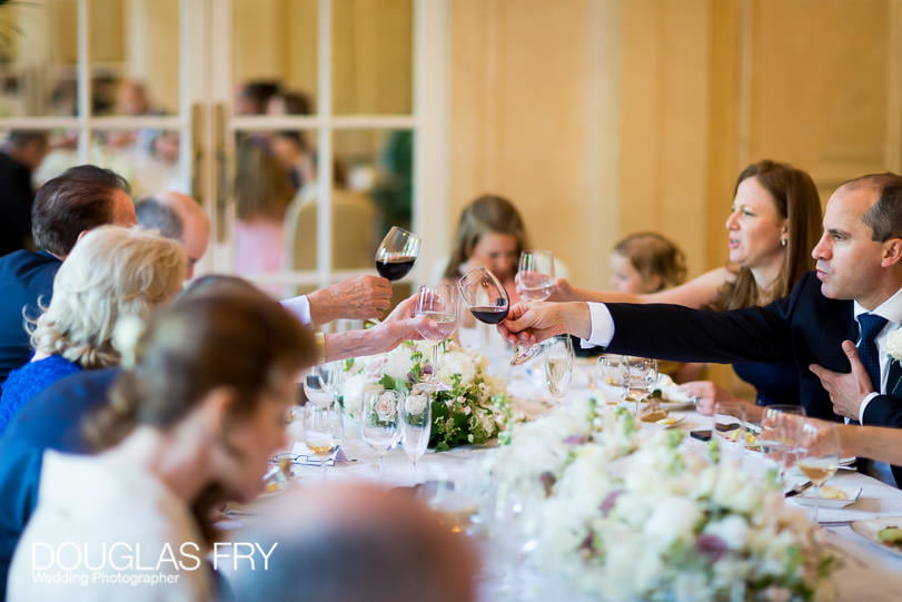 Wedding Photographer Mandarin Oriental Hotel - toasting the couple