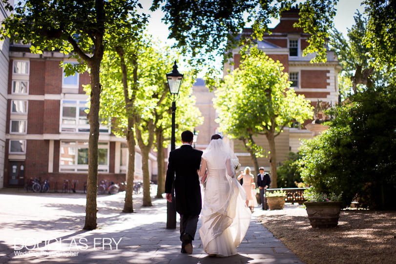 Couple walking in London streets - wedding photographer London