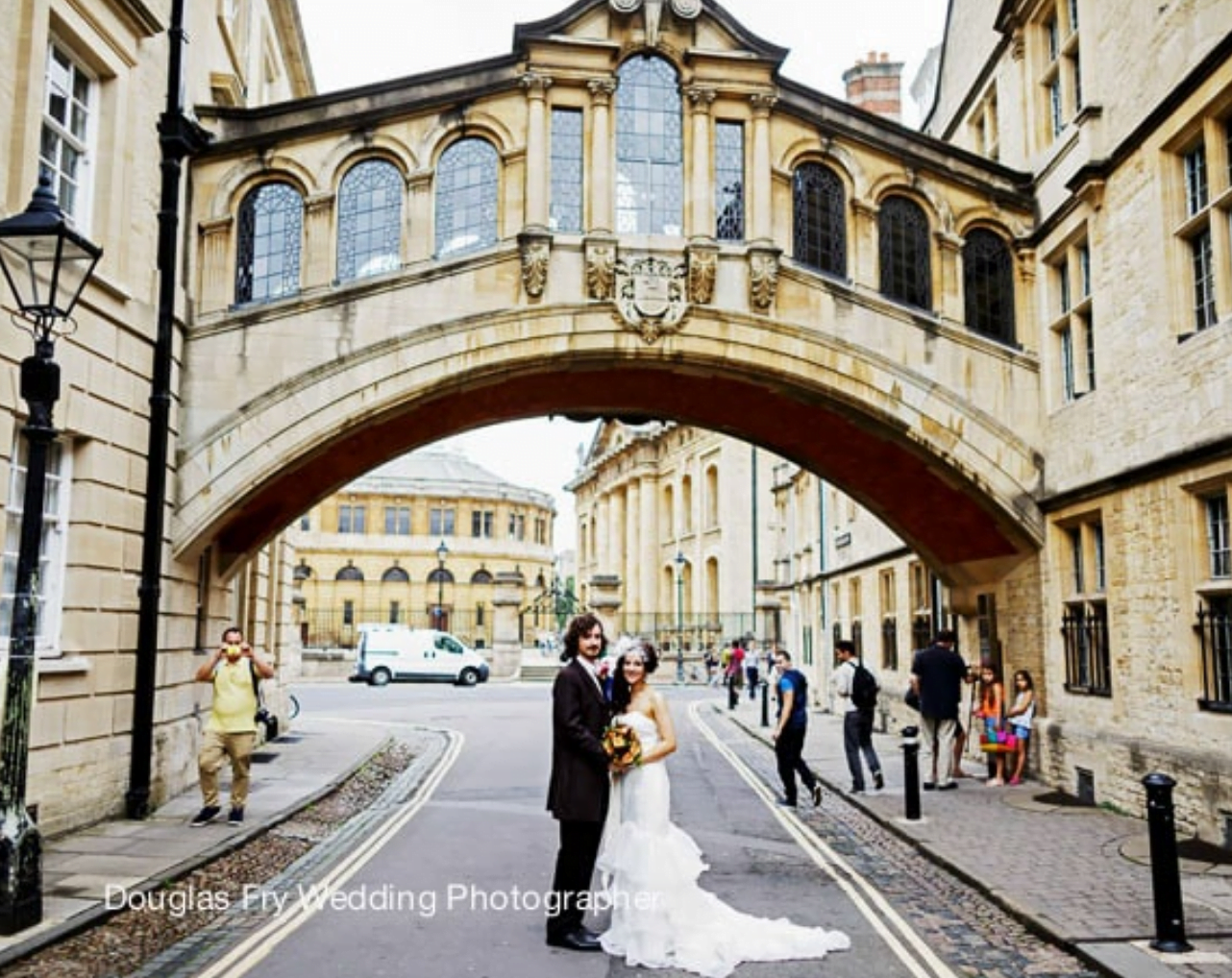 Couple photographed beneath the bridge of Sighs in Oxford