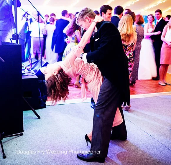 Wedding Photographer St Luke's Church Chelsea and Chiswick House 6 Guests dancing at Chiswick House in marquee photographed by Douglas Fry