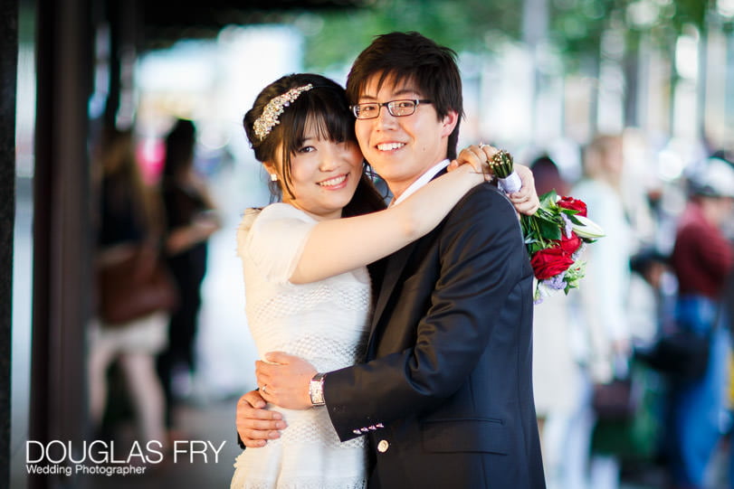 Couple photographed outside Harrods in Knightsbridge on wedding day