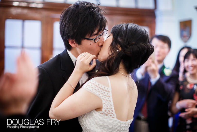 Wedding photograph of couple at Chelsea Regsiter Office during wedding ceremony