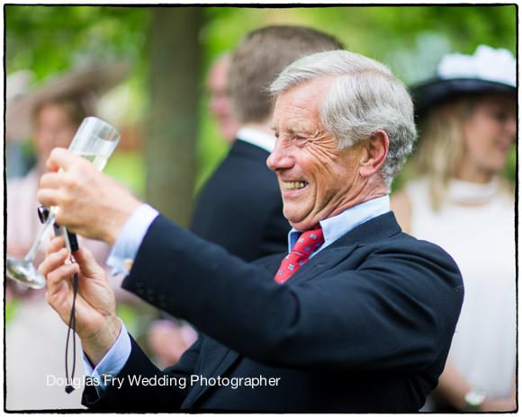 Wedding Photography of father with camera in Hampshire
