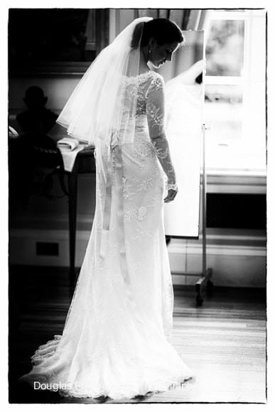 Wedding Photograph taken of bride getting ready in black and white