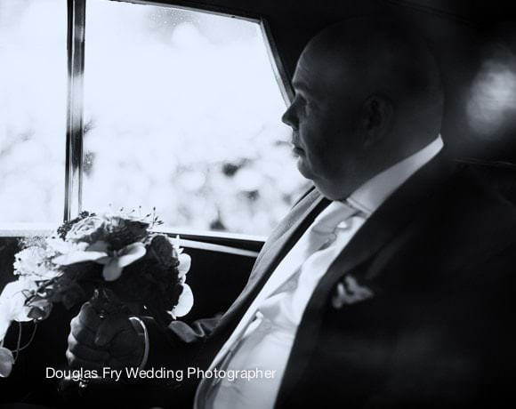 Destination Wedding on Location in the Netherlands 2 Groom in car - black and white