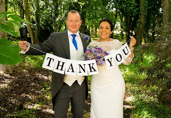 Wedding Thank You Card Tips and Ideas 8 Wedding Photograph - couple with thank you sign for cards
