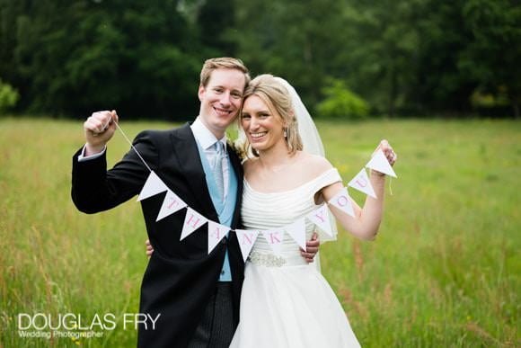 Wedding Thank You Card Tips and Ideas 1 Thank you card photograph of bride and groom with sign
