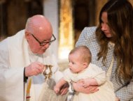 Christening photographer london - image of baby in church