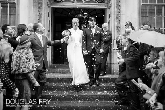 Wedding Photograph on the steps of Chelsea Register Office, Kings Road with confetti