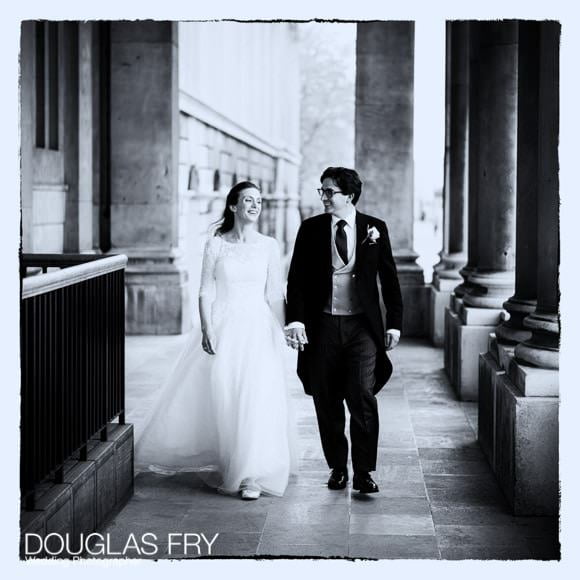 The bride and groom walking along at Greenwich - Black and white photograph