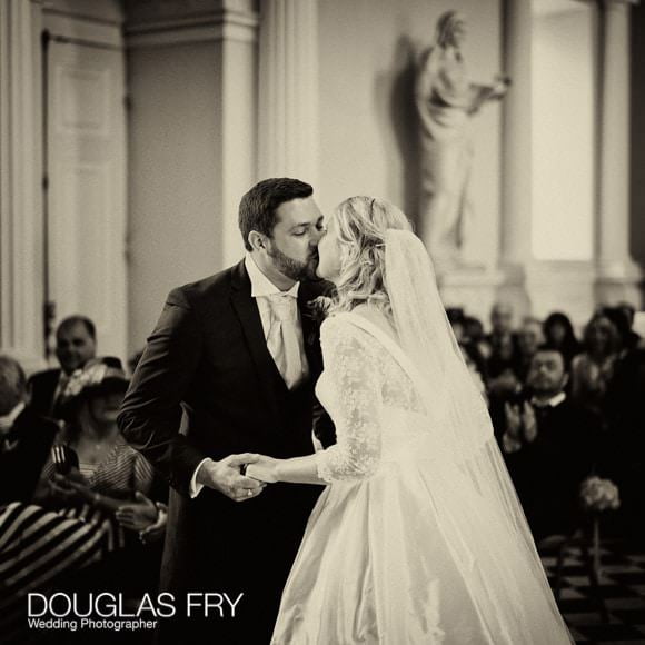 Wedding Photographed at Syon with Bride Getting Ready at The Hilton Syon Park 6 Sepia photograph of bride and groom kissing during Syon ceremony