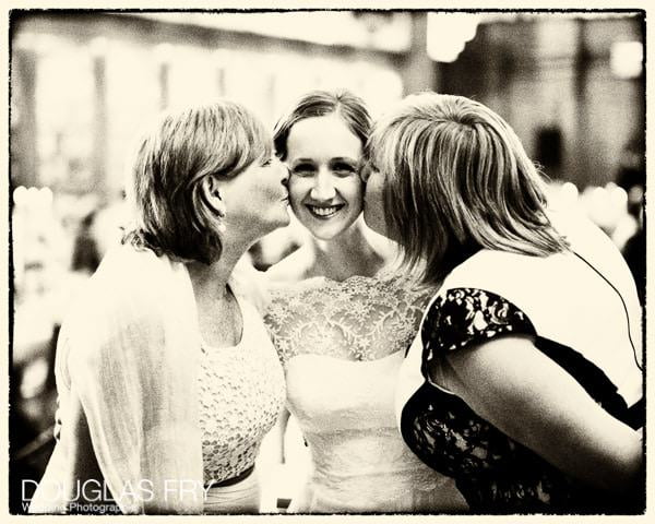 Wedding Photographer capturing bride with friends