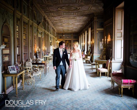 Bride and groom walking through Syon House