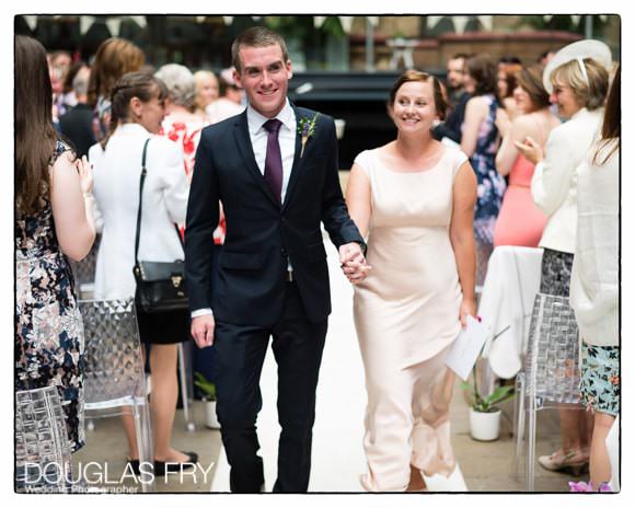 The couple after the ceremony walking down the aisle