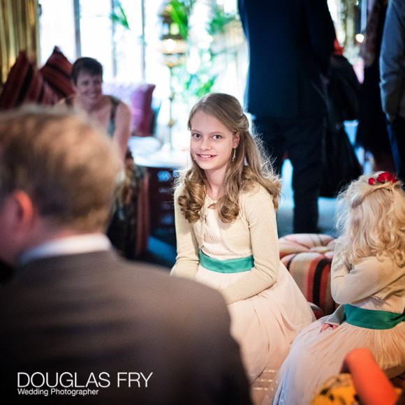 Bridesmaid sitting waiting at wedding in Crazy Bear Hotel
