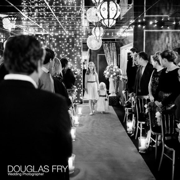 Bridesmaids walking down aisle at Crazy Bear wedding in Beaconsfield