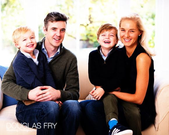 Group photograph of family at home in Clapham