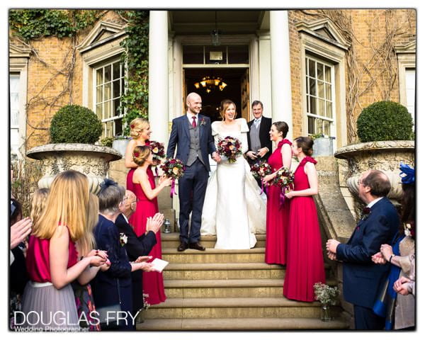 Couple on steps after wedding service taken on Leica camera and lens