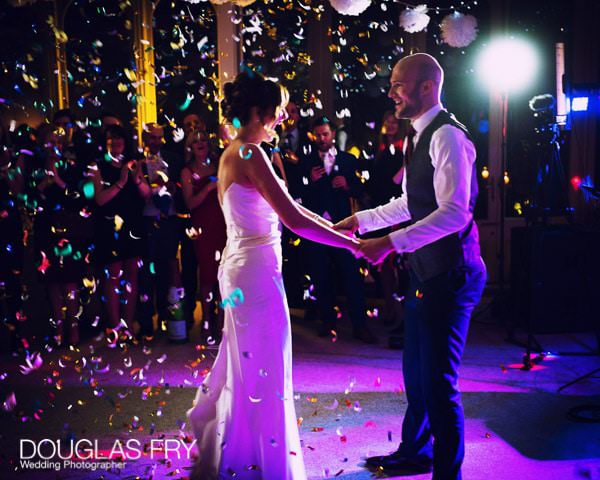 Bride and groom dancing with confetti - Leica image