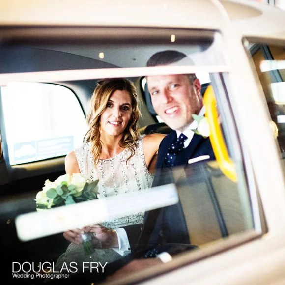 Laura and Andy's Wedding Photographed at Soho Hotel and the Union Club 3 Bride and Groom in Taxi on way to Union Club in Soho