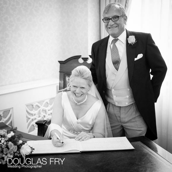 Photograph of signing the register at Chelsea Register office