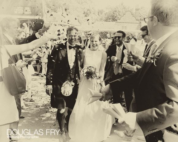 Bride and Groom with confetti during London wedding