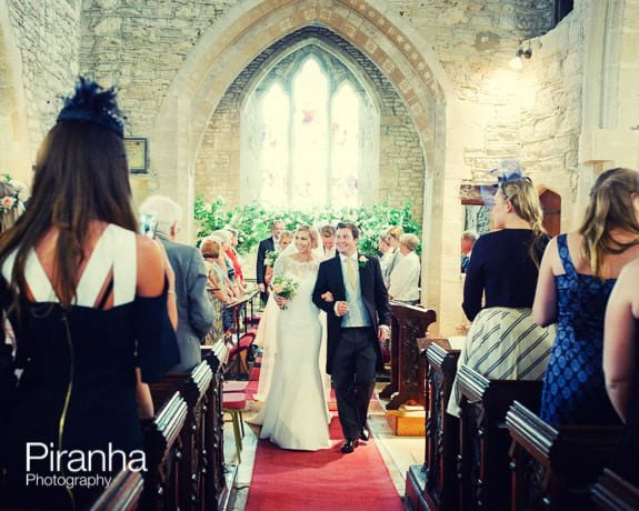 Wedding Photography of bride and groom walking down aisle in Gloucestershire