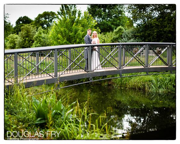 Couple standing on bridge at Syon Park