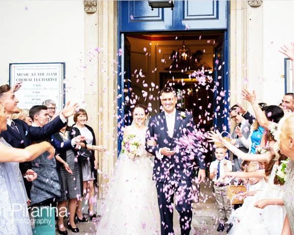 No 4 Hamilton Place Wedding in July 3 Bride and groom leaving church with confetti in London