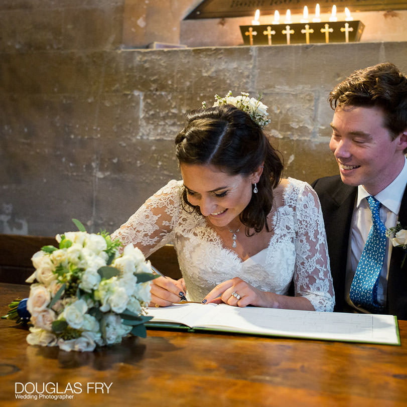 Signing the register in Hampshire church after wedding