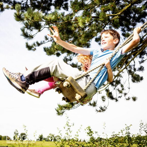 Family and Children Photographed in Gloucestershire - Summer 2017 1 Photograph of children on swing in Garden