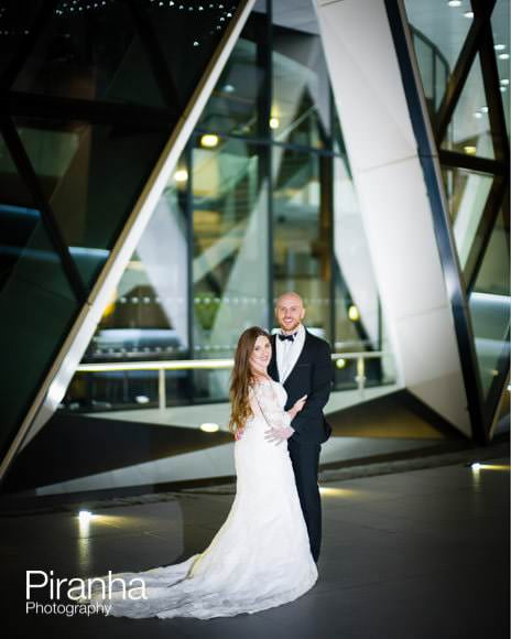 Bride and groom photographed in front of Gherkin