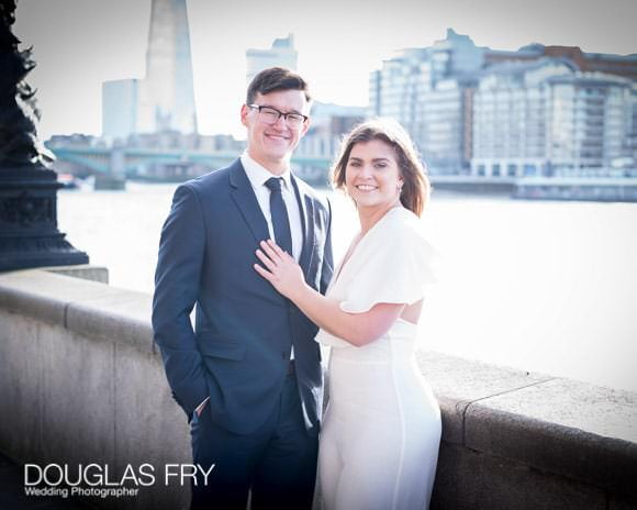 Couple photographed in London by Tate modern with the Shard in the background