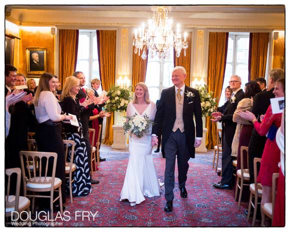 Bride and groom at end of wedding ceremony at Savile Club in London