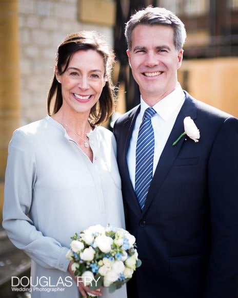 Couple on steps of Oxford Register Office after the ceremony