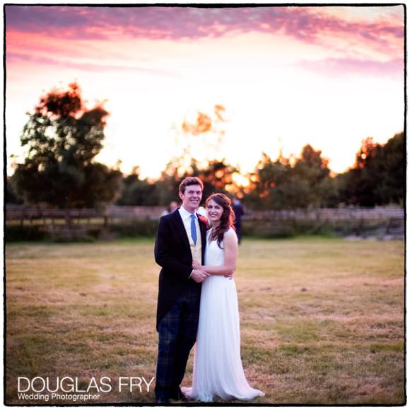 Bride and groom photographed during sunset at Gloucestershire wedding