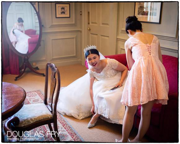 Bride and bridesmaid preparing for wedding ceremony at Admirals house in Greenwich