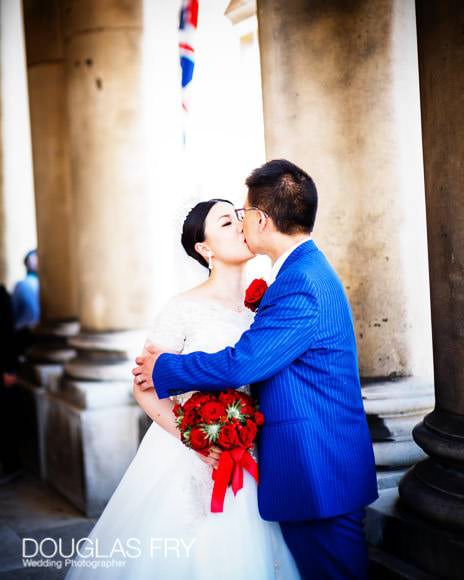 couple kissing at Old Royal Naval College in Greenwich