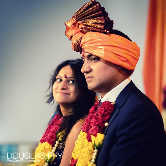 Hindu engagement ceremony - couple listening