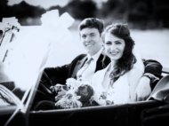 Couple photographed in vintage car leaving wedding church service