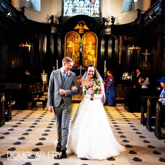 Bride and Groom walking down aisle at end of wedding ceremony in London