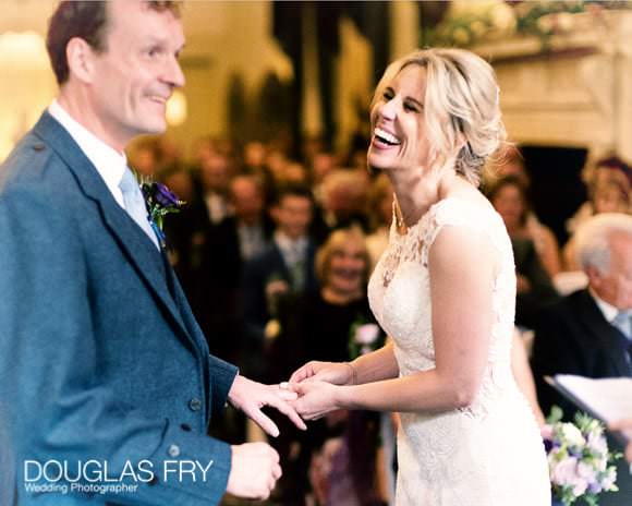 Bride and groom laughing during the marriage ceremony