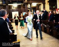 Bride and father of the bride walking down aisle at St Lawrence Jewry in London