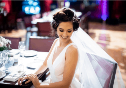 Photograph of model wearing new Sassi Holford wedding dress at Stationers' Hall fashion show