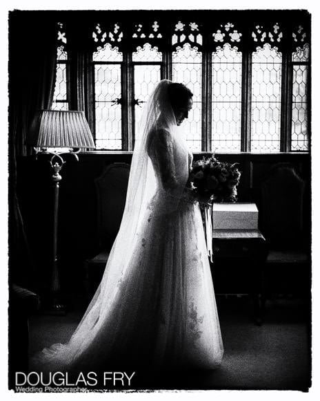 Bride in black and white at Hever Castle in Kent