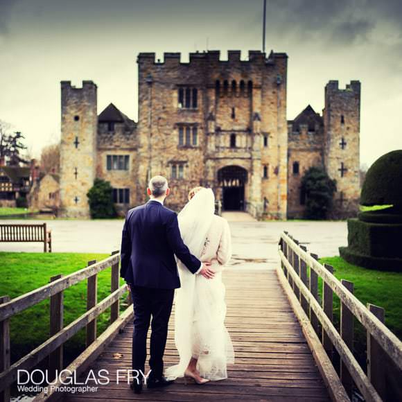 couple photographed with Hever Castle behind