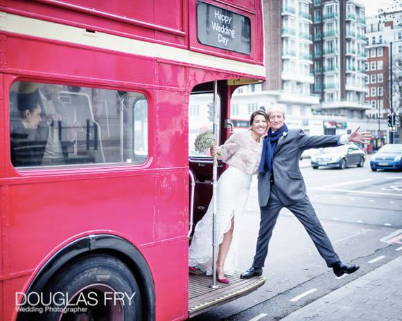 Photograph of bride and groom on London routemaster bus