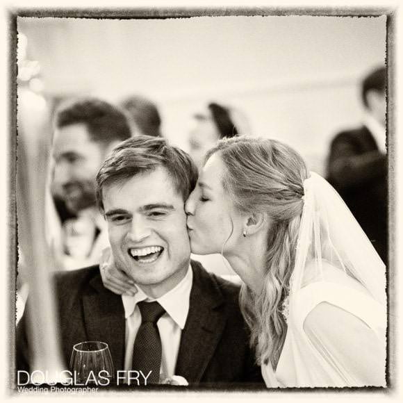 kiss during wedding reception at 28 Portland Place in London