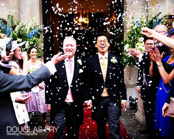 Couple with confetti in front of St George's Hanover Square in London